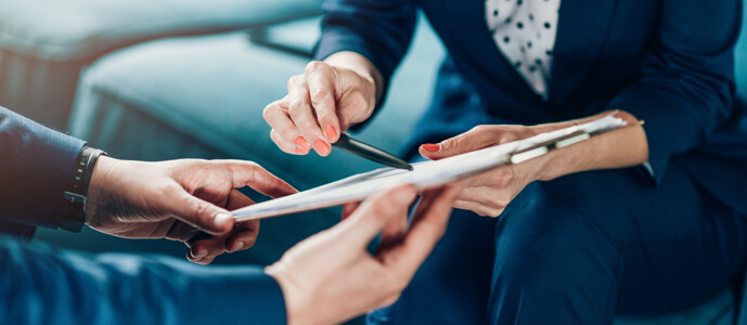 Two professionals review tax information